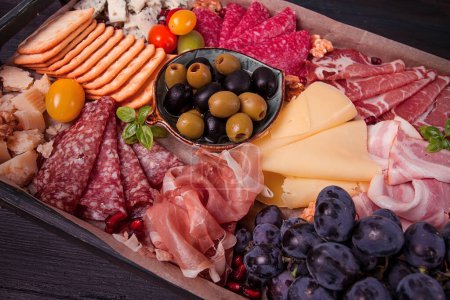 Appetizer, assortment, set, sausage, and cheese, on a wooden board, top view, no people,