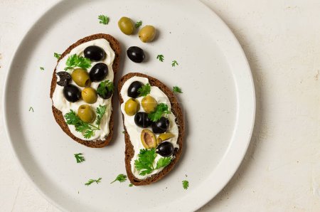 Photo for Breakfast sandwiches, with cream cheese, olives, top view, - Royalty Free Image