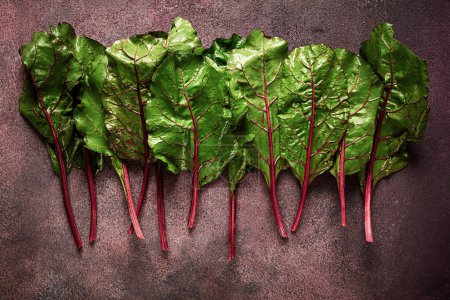 Photo for Fresh, green leaves, stem with beet leaves, on the table, top view, rustic, no people, - Royalty Free Image