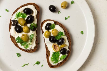 Photo for Breakfast, sandwiches, with cream cheese, olives, top view, - Royalty Free Image