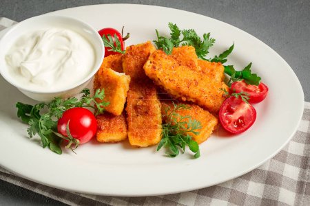 fried fish nuggets, with white sauce, arugula and cherry, no people,
