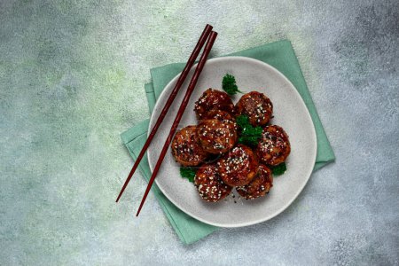 Photo for Tsukune, Japanese meatballs, minced chicken, fried on a skewer, with yakitori sauce, homemade, no people, - Royalty Free Image
