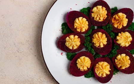 stuffed eggs, stained with beetroot juice, purple, pitaya powder, top view, top view, close-up, no people,