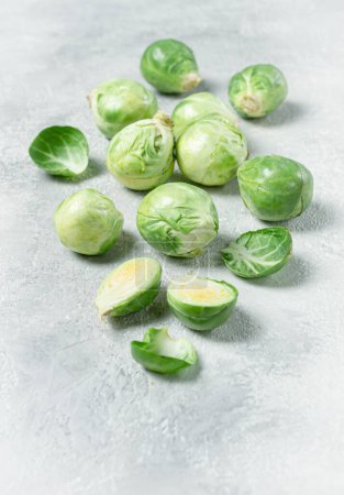 fresh Brussels sprouts, raw, top view, on a gray table, no people,