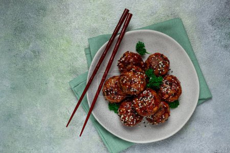 Photo for Tsukune, Japanese meatballs, minced chicken, fried on a skewer, with yakitori sauce, homemade, no people, - Royalty Free Image