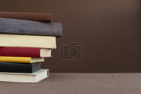 Photo for Stack of books on wooden table - Royalty Free Image