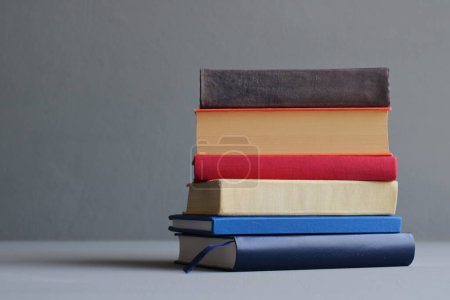 Photo for Stack of books on gray - Royalty Free Image