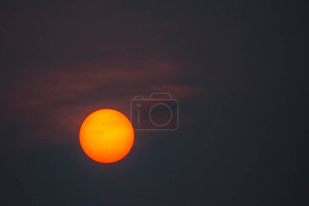 Photo for Early evening sun in Wisconsin dulled be the Canadian wild fires in June of 2023, horizontal - Royalty Free Image
