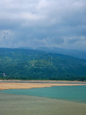 Photo for Amazing hill view of the Meghalayan hill range from the Jadukata river near the India Bangladesh border with the magnificent river of Bangladesh in the front. - Royalty Free Image
