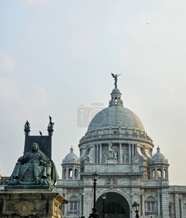 Magnificent architecture of the Victoria Memorial at Kolkata, India. Top of the Victoria Memorial with the statue of queen Victoria in front