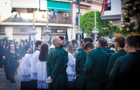 Photo for April 8th 2023 - Dona Mencia, Cordoba, Spain. Devotee man looking up and waiting for procession to start. Parade actors ready for the Holly Week Procession - Royalty Free Image