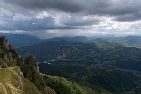 Photo for Downpour over mountains and gloomy clouds, view from Vlasic mountain - Royalty Free Image