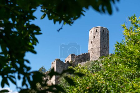 Photo for Gavran-Kapetanovic tower in medieval town Pocitelj on bank of Neretva river during sunny day - Royalty Free Image