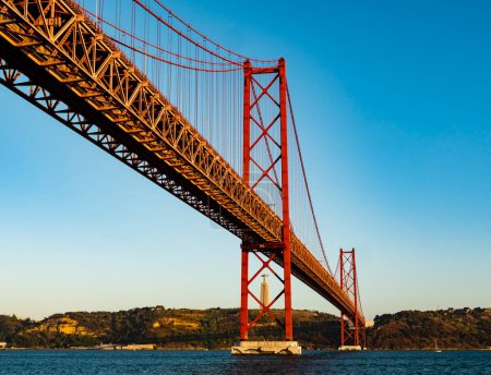 Photo for Impressive view of the 25 de Abril (25th April) suspension bridge crossing the Tagus river, Belem district, Lisbon, Portugal - Royalty Free Image