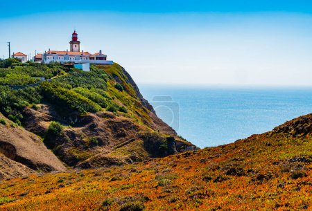 Stunning landscape with Cabo da Roca lighthouse overlooking the promontory towards the Atlantic Ocean, Portugal