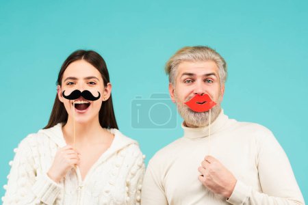 Gender, equality diversity concept. Identity transgender, gender stereotypes. Male female portrait. Funny couple of woman with moustache and man with red lips