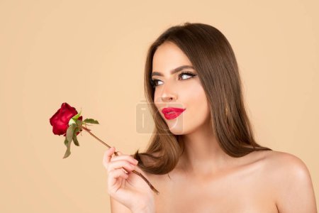 Beautiful woman face and flower. Girl and rose. Close-up portrait, skin care, make-up