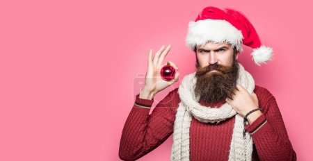 Photo for Bearded santa man, christmas card, new year banner with copy space. Funny santa isolated over red studio background - Royalty Free Image