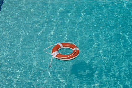 Photo for Lifebuoy in a blue sea. Weter help background - Royalty Free Image