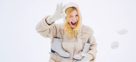 Photo for Winter banner. Crazy comical face show OK. Love winter. Funny smiling woman outdoor. Girl laughing and having fun in winter park. Winter funny woman with ice-skating - Royalty Free Image