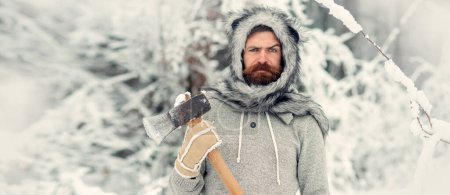 Photo for Lumberjack man with axe on winter background. Hipster with beard on serious face with axe. Brutal lumberjack in winter outdoor. Lumberjack hipster in snowy forest. Lumberjack for winter banner concept - Royalty Free Image