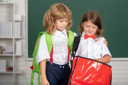 Téléchargez les photos : Back to school. Two little schoolkids. Education and friendship in school concept - en image libre de droit