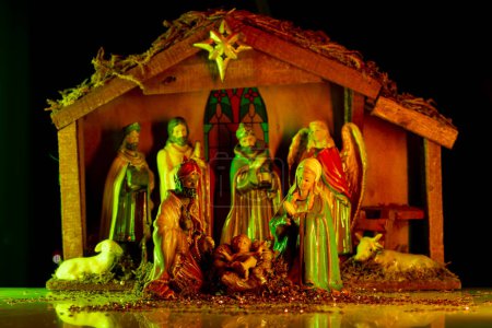 Photo for Christmas nativity scene. Christmas Jesus in crib. Christmas nativity scene of born Jesus Christ in the manger with Joseph and Mary. Traditional Christmas nativity scene of baby Jesus in the manger - Royalty Free Image