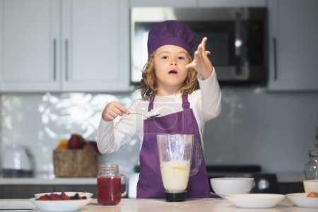 Photo for Kid cooking. Chef child cook baking on the kitchen - Royalty Free Image