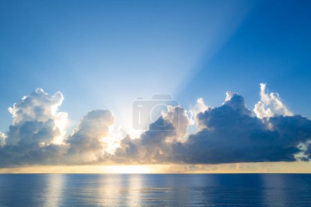 Photo for Sunset on sea background. Nature wallpaper with summer sea. Water sea texture. Calm sunrise on tropical sea. Clouds and waves on ocean dusk, twilight - Royalty Free Image
