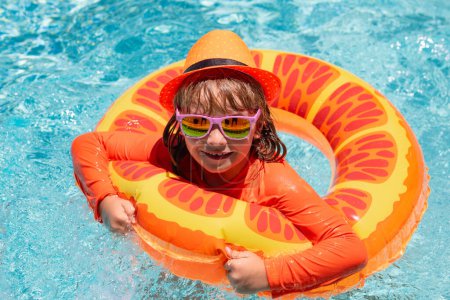 Photo for Kid boy relaxing in pool. Child swimming in water pool. Summer kids activity, watersports. Summer vacation with children - Royalty Free Image