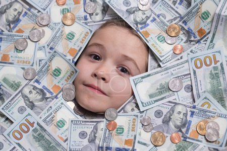 Photo for Money win, big luck. Funny face in lot of money. Fun kid face on dollars money. Money banknotes, cash dollars bills, 100 American dollars banknotes - Royalty Free Image