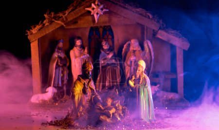 Photo for Traditional Christmas scene birth of Jesus. Christmas Jesus in crib. Christmas nativity scene of born Jesus Christ in the manger with Joseph and Mary - Royalty Free Image