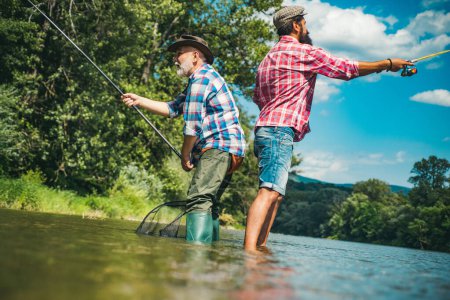 Photo for Fisherman men friends and trophy trout. Father and son fishing. Generations men fishing in river - Royalty Free Image