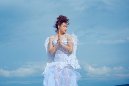 Photo for Valentines angel teen praying. Angel teen in heaven - Royalty Free Image