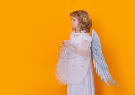 Photo for Angel prayer. Little cupid angel child with wings with prayer hands, hope and pray concept. Studio portrait of angelic kid - Royalty Free Image