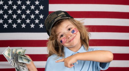 Foto de American money. Rich kid with dollars. Lottery cashback, win big money isolated background. United States of America concept. Child with american flag - Imagen libre de derechos