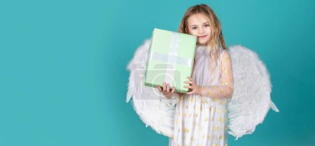 Photo for Angel child banner, isolated studio background. Valentines Day. Angel child from heaven gives you gift - Royalty Free Image