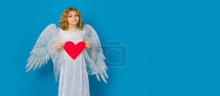 Photo for Child with angel wings hold paper heart. Symbol love and valentines day. Valentines day banner. Cute child with angel wings. Wide banner panoramic header - Royalty Free Image