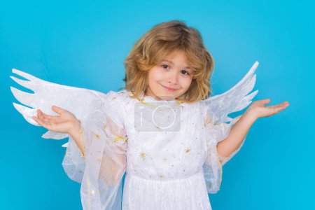 Photo for Valentine angel. Little cupid child. Kid angel with angels wings, isolated on blue studio background. Valentines day gift card - Royalty Free Image