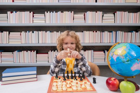 Photo for Chess school for kids. Kid playing chess. Child thinking near chessboard. Learning and growing children, childgood. Kids early development - Royalty Free Image