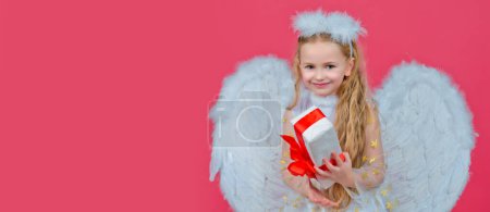 Photo for Angel kid banner, isolated studio background. Gift child emotions. Cute angel child girl with angels wings, isolated on red. Valentines day. Playful angelic little girl - Royalty Free Image