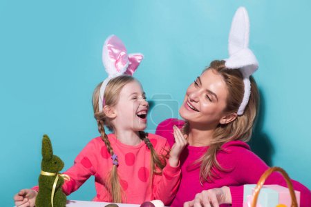 Photo for Family happy easter. Mom with daughter are preparing for Easter. Mother and child wearing bunny ears. Easter banner, poster flyer header for website - Royalty Free Image