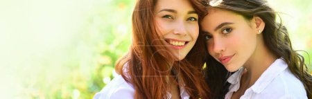 Photo for Sensual woman spring outdoor portrait banner. Sisters having fun outdoor. Cute positive portrait of best friend pretty young girls, spring time, hugs and having fun, natural make up - Royalty Free Image