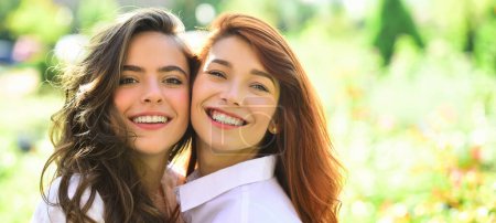 Photo for Sensual woman spring outdoor portrait banner. Lifestyle and people concept. Young girl friends standing together and having fun in spring park - Royalty Free Image
