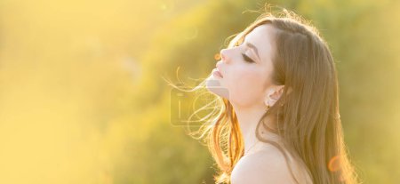 Photo for Spring woman on sunlight romantic portrait, sensual sunny face. Banner for website header. Portrait of a young woman, close up face of beautiful woman outdoor side profile portrait - Royalty Free Image