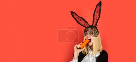Foto de Happy young woman wearing bunny ears and having Easter Eggs. Smile easter. Horizontal photo banner for website header design - Imagen libre de derechos