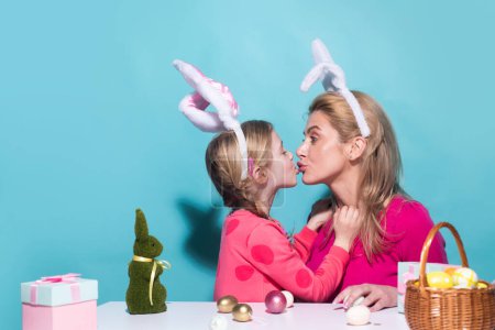 Foto de Daughter kiss her mother for Easter, isolated. Horizontal photo banner for website header design - Imagen libre de derechos
