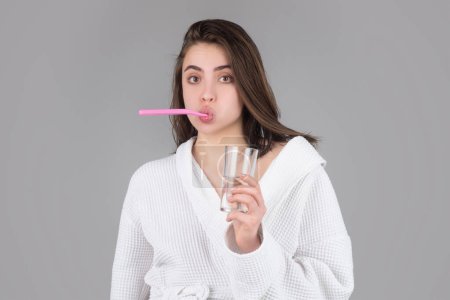 Foto de Beauty portrait of a happy beautiful woman brushing her teeth with a toothbrush isolated background - Imagen libre de derechos