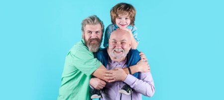 Foto de Fathers day. Happy man family concept laugh and have fun together. Three generations ages: grandfather father and child son together. Male Multi Generation Family, isolated - Imagen libre de derechos
