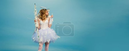 Photo for Valentines day banner with angel teen. Cupid cute angel with bow and arrows. Pretty white little girl as the cupid with a bow and arrow congratulating on St Valentines day. Valentines day cupid. Love - Royalty Free Image
